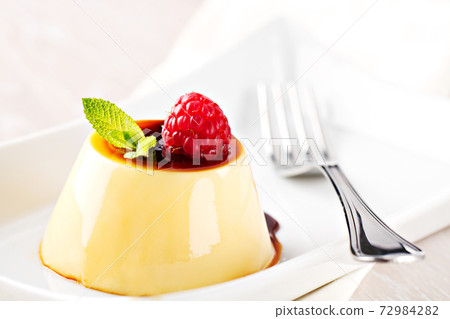 Pudding With Berries and Caramel Sauce. High quality photo Pudding With Berries and Caramel Sauce. High quality photo 72984282