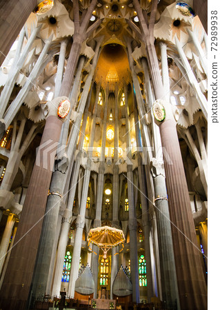 Inside the Sagrada Familia in Barcelona, Spain, colorful stained glass and unusually designed interior 72989938