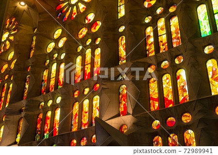 Inside the Sagrada Familia in Barcelona, Spain, colorful stained glass and unusually designed interior 72989941