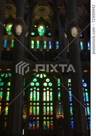 Inside the Sagrada Familia in Barcelona, Spain, colorful stained glass and unusually designed interior 72989942