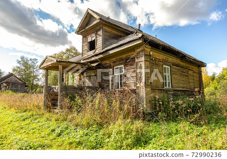 Abandoned old rural wooden house in russian village Abandoned old rural wooden house in russian village 72990236
