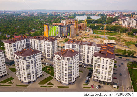 Aerial view of city residential area with high apartment buildings. Aerial view of city residential area with high apartment buildings. 72990864