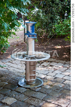 Water column in park Water column in park 72991756