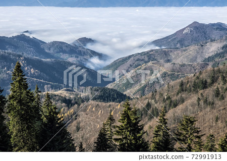 Big Fatra mountains and Turiec basin, Slovakia, inverse weather scene Big Fatra mountains and Turiec basin, Slovakia, inverse weather scene 72991913