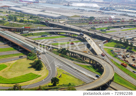 Aerial view of empty highway interchange with disappearing traffic on a bridge and streets roads and lanes crossroads cars Newark NJ US Aerial view of empty highway interchange with disappearing traffic on a bridge and streets roads and lanes crossroads cars Newark NJ US 72992286