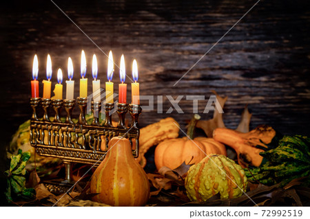 Kwanzaa holiday with decorate candles and pumpkin on wooden background 72992519
