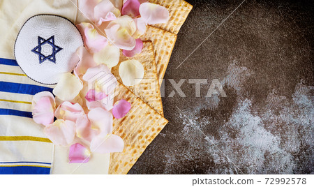 Matzoh jewish holiday bread Jewish family celebrating passover on talit and kippa 72992578
