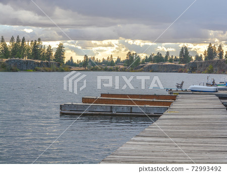 Fishing dock on the waters of  Williams Lake in Cheney, Spokane County, Washington 72993492