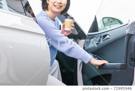 A young woman driving A young woman driving 72995946