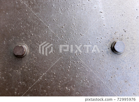2 bolts on a metal plate 2 bolts on a metal plate 72995976