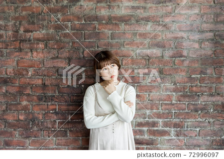  Thinking young lady 72996097