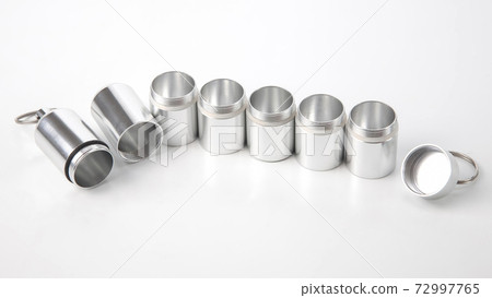 sealed aluminum containers for small items and medical pills on a white background sealed aluminum containers for small items and medical pills on a white background 72997765