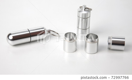 sealed aluminum containers for small items and medical pills on a white background sealed aluminum containers for small items and medical pills on a white background 72997766