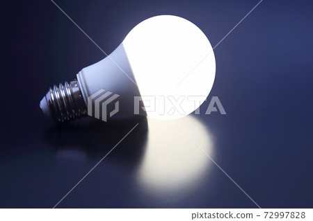 modern led lamp is turned on a dark background modern led lamp is turned on a dark background 72997828
