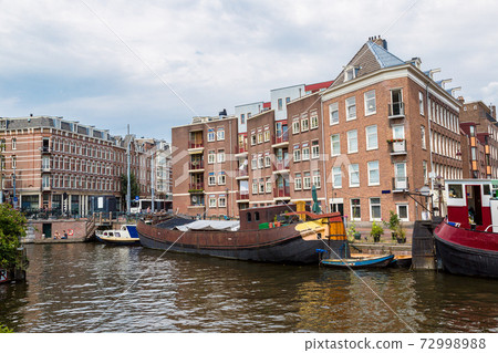 Amsterdam canals and  boats, Holland, Netherlands. 72998988