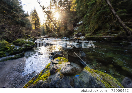 Stack of Rocks by the beautiful river in Canadian Nature Stack of Rocks by the beautiful river in Canadian Nature 73000422