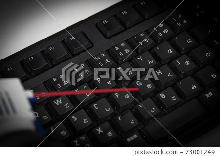 Cleaning the keyboard with an air duster Cleaning the keyboard with an air duster 73001249