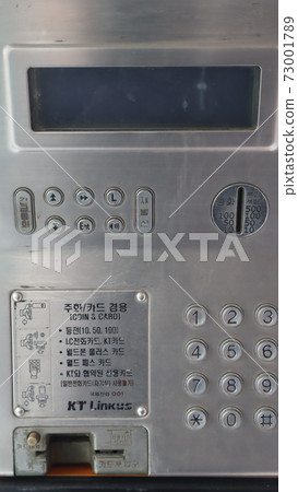 Telephone in a public telephone booth 73001789