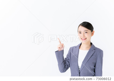 Business image Young woman pointing Business image Young woman pointing 73006012