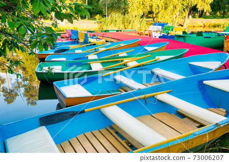 Row of colorful boats at pier 73006207