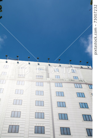 Cityscape of Barcelona, Spain A picture curtain of a building hanging in front of a building under construction 73007232