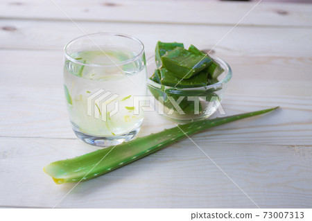 Aloe Vera for drinking on wood table 73007313