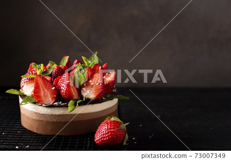 chocolate coffee cake with fresh strawberries and mint 73007349