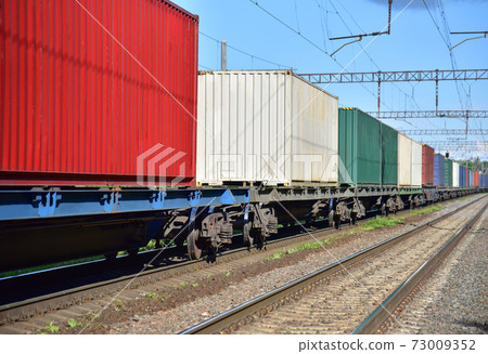 Cargo Containers Transportation On Freight Train By Railway. Intermodal Container On Train Car.  73009352