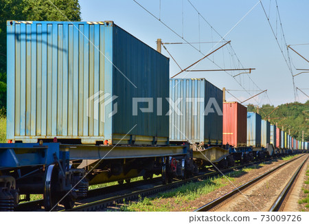 Cargo Containers Transportation On Freight Train By Railway. Cargo Containers Transportation On Freight Train By Railway. 73009726