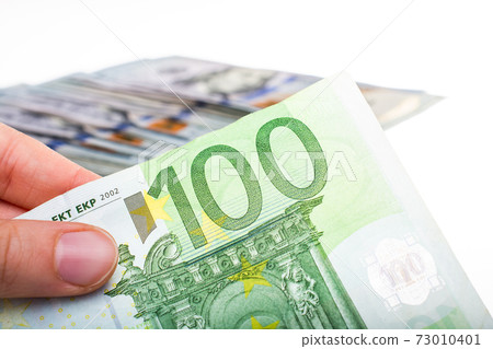 Hands holding cash euro banknotes currencies. 73010401