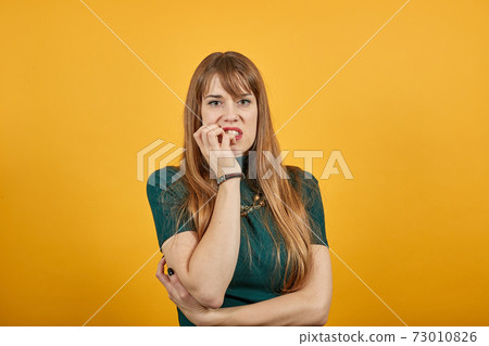 Hand on chin thinking about question, pensive expression. Thoughtful face. 73010826