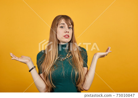 Wide open arms, incredulity, doubt beautiful woman. Is surprised spread palms 73010847