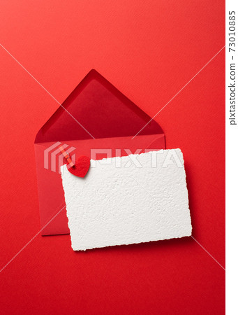 Valentines Day greeting card in envelope on a red background Valentines Day greeting card in envelope on a red background 73010885
