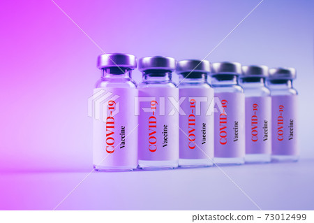 COVID-19 vaccine vials against purple background with copy space for text - coronavirus vaccine doses, global vaccination concept. Selective focus, toned image COVID-19 vaccine vials against purple background with copy space for text - coronavirus vaccine doses, global vaccination concept. Selective focus, toned image 73012499