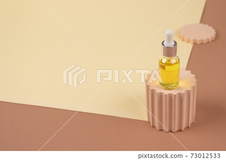 Dropper bottle - natural organic cosmetics, hyaluronic acid, serum, moisturizer or facial anti-aging oil. Essential oil in trendy neutral still life composition. Modern apothecary, mockup Dropper bottle - natural organic cosmetics, hyaluronic acid, serum, moisturizer or facial anti-aging oil. Essential oil in trendy neutral still life composition. Modern apothecary, mockup 73012533