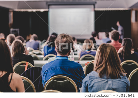 Audience in lecture hall participating at business conference. 73013641