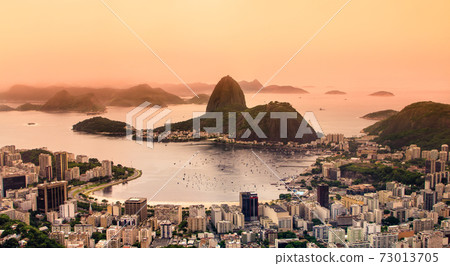 Rio de Janeiro, Brazil. Suggar Loaf and Botafogo beach viewed from Corcovado at sunset 73013705