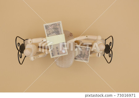 A drawing doll receiving a kickback under the desk A drawing doll receiving a kickback under the desk 73016971