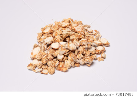 Sand ginger dried roots heap on white background 73017493