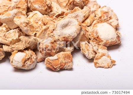 Sand ginger dried roots heap on white background Sand ginger dried roots heap on white background 73017494