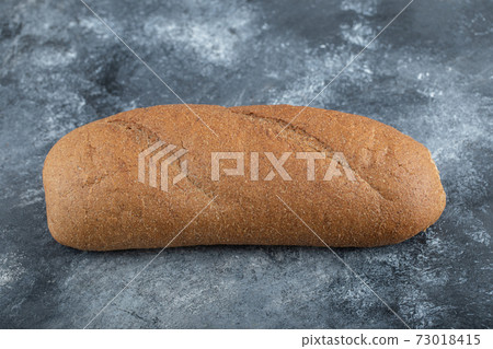 Loaf of bread isolated on white background. Whole bread. Horizontal frame. Studio Loaf of bread isolated on white background. Whole bread. Horizontal frame. Studio 73018415