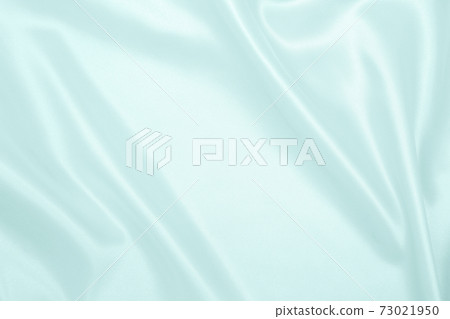Smooth elegant blue silk or satin luxury cloth texture as abstract background. Luxurious background design Smooth elegant blue silk or satin luxury cloth texture as abstract background. Luxurious background design 73021950
