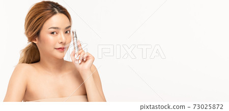 Beauty asian woman hold bottle cosmetic cream lotion and cheerful. Beauty asian woman hold bottle cosmetic cream lotion and cheerful. 73025872