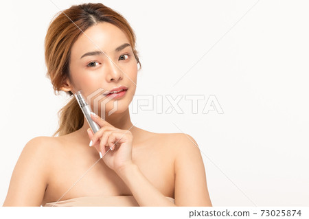 Beauty asian woman hold bottle cosmetic cream lotion and cheerful. Beauty asian woman hold bottle cosmetic cream lotion and cheerful. 73025874