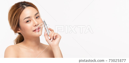Beauty asian woman hold bottle cosmetic cream lotion and cheerful. Beauty asian woman hold bottle cosmetic cream lotion and cheerful. 73025877
