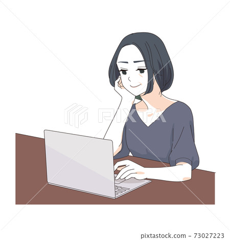A woman in her 40s operating a laptop 73027223