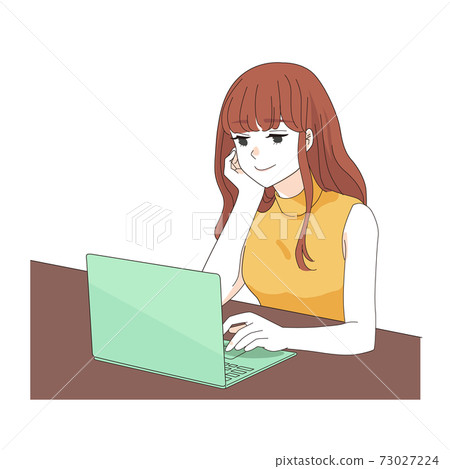 A woman in her twenties operating a laptop 73027224