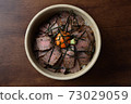 Delicious roast beef bowl (overhead view) 73029059
