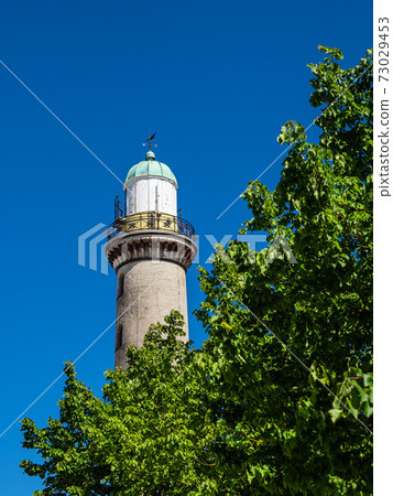 View to the Lighthouse in Warnemuende, Germany 73029453