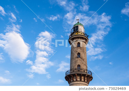 View to the Lighthouse in Warnemuende, Germany View to the Lighthouse in Warnemuende, Germany 73029469